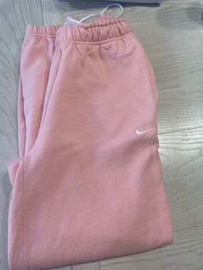 Nike woman’s Pink Joggers with White Swoosh